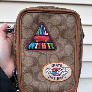 Coach CJ671 LGBTQ Stanton Crossbody Bad with leather logo patches, Pride Edition